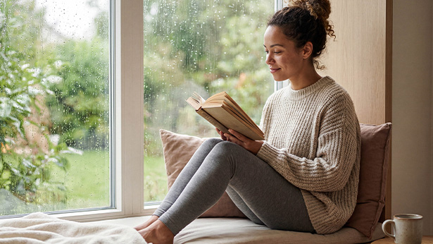 modern home gym with large windows featuring exercise equipment and a yoga mat surrounded by natural elements and a fitness mirror 3 workout ideas 3 wellness features 3 fitness accessories