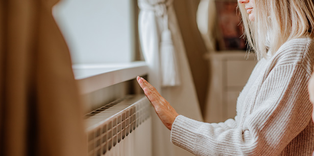 person using tablet in outdoor setting inspecting garden with debris nearby for three tasks