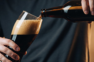 golden logo design featuring a structure with nine sleek lines representing elegance and modern architecture